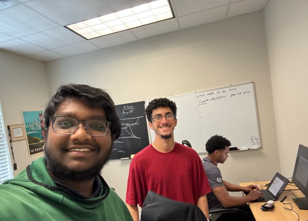 Office selfie with Ahmed in front of the whiteboard